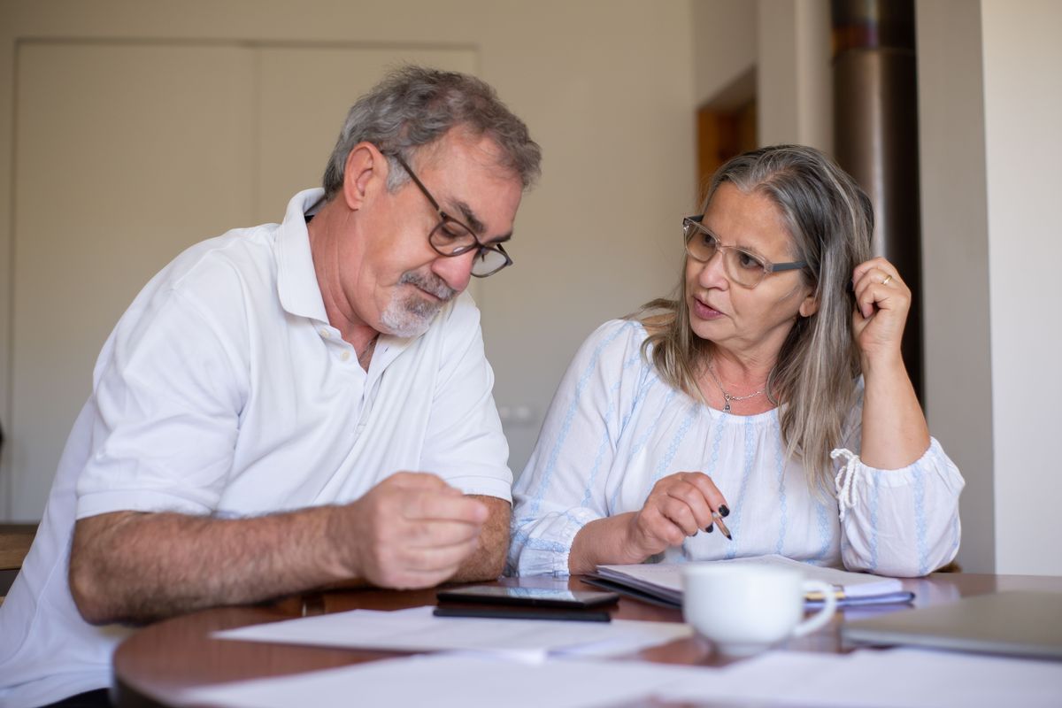 Older couple reviewing important planning documents together