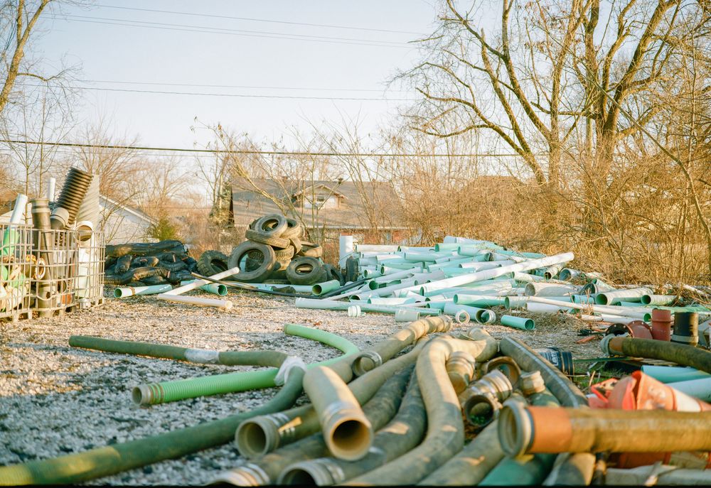 Property and yard cleanout with debris ready to be hauled