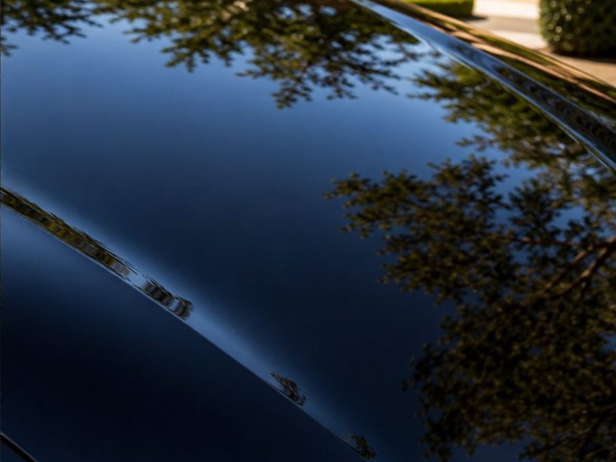 Glossy car paint after a completed detailing service