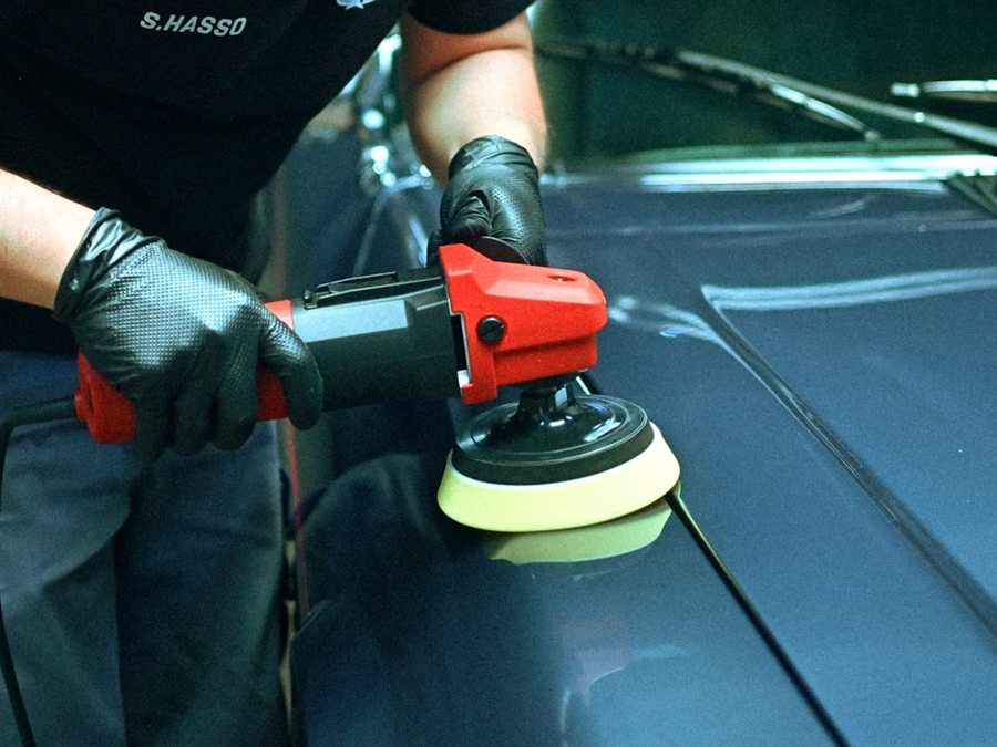 Paint being machine polished before a ceramic coating is applied