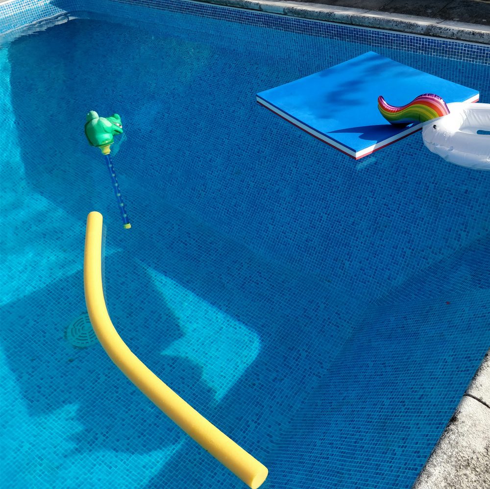 Sparkling clean backyard swimming pool